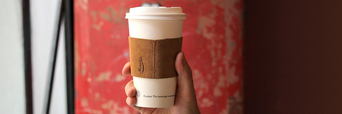 A leather coffee cup sleeve