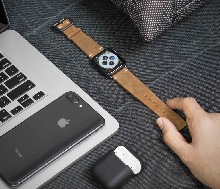 Smoked-Walnut-Apple-watch-brown-leather-vintage-band-on-top-grey-sofa-bs