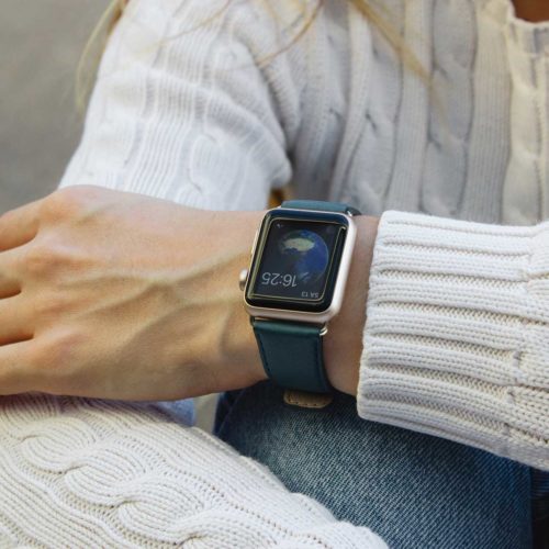 Denim-Apple-watch-nappa-band-on-top-of-a-white-female-pullover