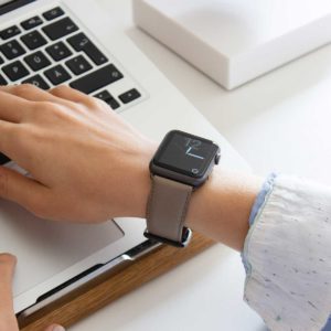 Pottery-Apple-watch-grey-nappa-band-for-her-typing-on-keyboard