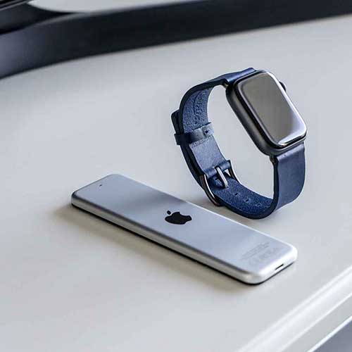 Blue-England-Apple-watch-blue-full-grain-leather-band-on-silver-desk-close-to-a-macpro