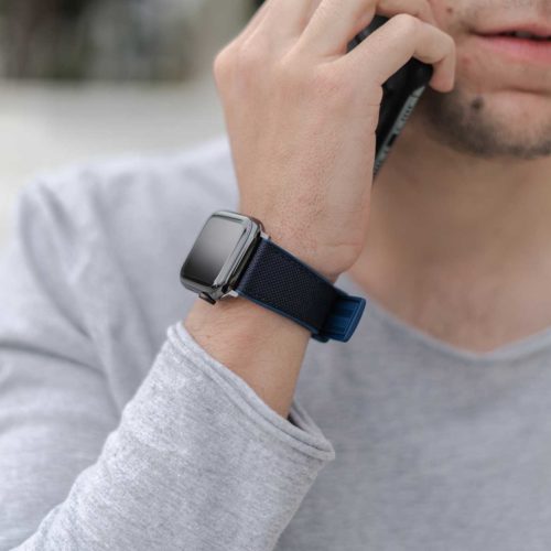Apple-watch-deep-blue-natural-rubber-band-for-him-close-to-an-iphone