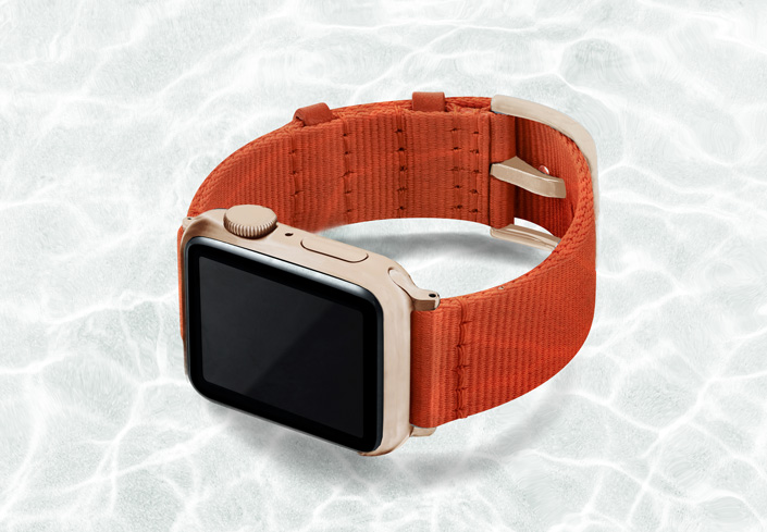 AW-orange-tide-recycled-by-ocean-band-40mm-case-on-left-with-aluminium-gold-adaptors